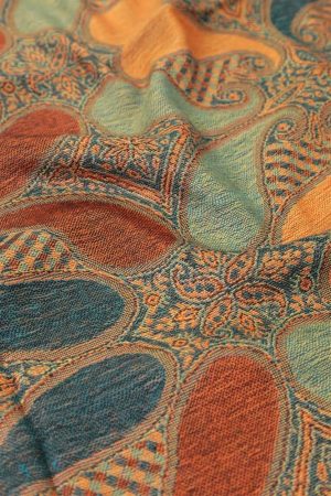 fabric detail of dark teal orange multi color paisley pashmina