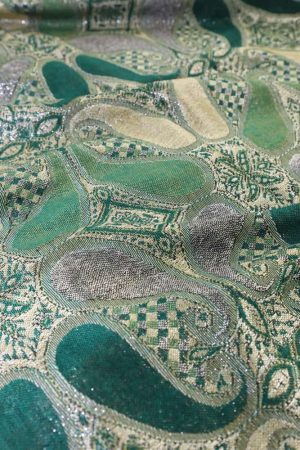 fabric detail of emerald green metallic pashmina shawl