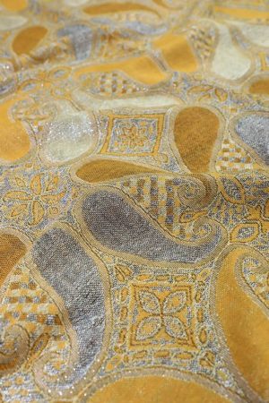 fabric detail of gold metallic pashmina shawl