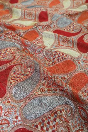 fabric detail of red metallic pashmina shawl